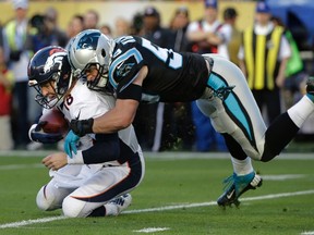 Denver Broncos quarterback Peyton Manning, left, is sacked by Carolina Panthers linebacker Luke Kuechly during Super Bowl 50 Sunday, Feb. 7, 2016, in Santa Clara, Calif. (AP Photo/Jae C. Hong)