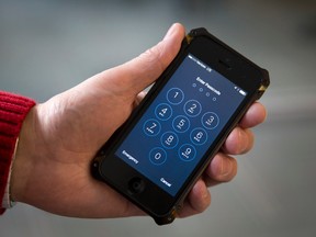 A U.S. magistrate judge has ordered Apple to help the FBI break into a work-issued iPhone used by one of the two gunmen in the mass shooting in San Bernardino, California. (AP Photo/Carolyn Kaster)