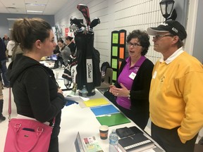 BRUCE BELL/THE INTELLIGENCER
Amy Miller (left) of Hillier visits with Sandi and Paul Farquhar of Wellington on the Lake Golf Course at the second annual Prince Edward County Job Fair in Picton on Wednesday. Miller was one of hundreds of job seekers dropping off resumes to potential employers during the afternoon event.