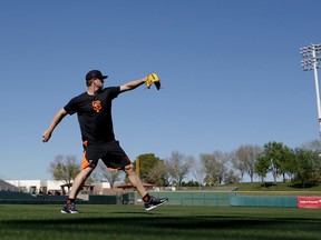 San Francisco Giants pitcher Matt Cain warms up the day before spring training begins in Scottsdale, Ariz., Wednesday, Feb. 17, 2016. (AP Photo/Chris Carlson)