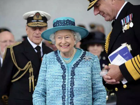 In this Ministry of Defence handout picture Queen Elizabeth II and Prince Philip, The Duke of Edinburgh (L) in a ship naming ceremony conducted at Rosyth Dockyard in Rosyth, Scotland on July 4, 2014. THOMAS TAM MCDONALD / GETTY