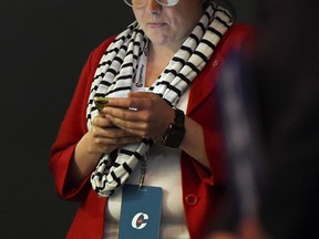 Conservative Party campaign manager Jenni Byrne, right, is seen at a Harper campaign stop in Toronto, Ontario on Tuesday, August 18, 2015.  THE CANADIAN PRESS/Sean Kilpatrick