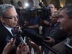 Joe Oliver arrives for a Conservative caucus meeting on Parliament Hill in Ottawa on Thursday, November 5, 2015. THE CANADIAN PRESS/Sean Kilpatrick