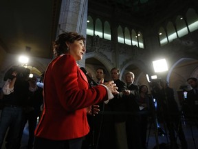 British Columbia Premier Christy Clark speaks to journalists on Parliament Hill in Ottawa March 31, 2014. REUTERS/Chris Wattie