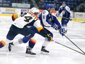 Sudbury Wolves foward Ryan Valentini tries to get past Erie Otters' Travis Dermott durng OHL action at Sudbury Community Arena on Jan. 10.