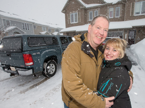 Gerry Marsh, posing outside his home with his girlfriend Marie-Paule Briere, was the hero of the neighbourhood on Tuesday evening when he used his pick-up truck to pull a bus loaded with passengers out of a snow bank in the Orleans Avalon area. (Wayne Cuddington)