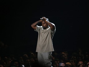 Kanye West pauses as he speaks at the Video Vanguard Award at the 2015 MTV Video Music Awards in Los Angeles, California, in this August 30, 2015 file photo. West, who says he is $53 million in debt, has asked Facebook Inc's Chief Executive Officer Mark Zuckerberg to invest $1 billion into his "ideas".  REUTERS/Mario Anzuoni/Files