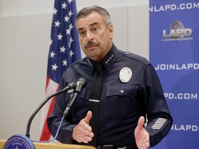 Los Angeles Police Chief Charlie Beck takes questions from the media at news conference at the LAPD headquarters downton Los Angeles on Wednesday, Feb. 17, 2016. Two Los Angeles police officers have been arrested and charged with repeatedly raping four women while on duty over a three-year period. The charges against Officers James Nichols and Luis Valenzuela were announced Wednesday and include rape under color of authority and oral copulation by force. Beck said that both officers have been suspended without pay since 2013. (AP Photo/Nick Ut)