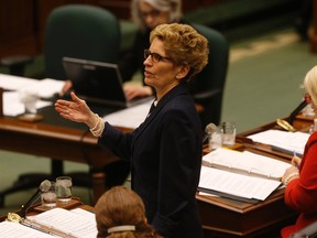 Ontario premier Kathleen Wynne responds to a question from the NDP at the opening of the Legislature on Tuesday February 16, 2016. Jack Boland/Toronto Sun