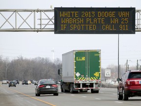 A highway sign on I-70, east of downtown Indianapolis, displays a message asking motorists to be on the look out for a vehicle that may be tied to the suspect in an earlier fatal shooting of an adult and a child in Zionsville, Ind., on Feb. 17, 2016. A man wanted in connection with the fatal shootings of his niece and her young son in suburban Indianapolis killed himself Wednesday afternoon at a downtown Indianapolis hotel, police said. (Robert Scheer/The Indianapolis Star via AP)