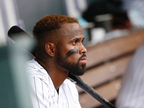 In this Aug. 16, 2015, file photo, Colorado Rockies shortstop Jose Reyes looks on from the dugout during a game against the San Diego Padres in Denver. (AP Photo/David Zalubowski, File)