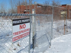 A no trespassing sign hangs on the fence around the former Holmes Foundry land on Thursday February 18, 2016 in Point Edward, Ont. The long-vacant site is the subject of a trial set to begin in September.
(Paul Morden/Sarnia Observer/Postmedia Network)