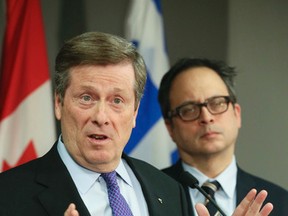 Mayor John Tory and Deputy Mayor Denzil Minnan-Wong during a press conference for an update on the city budget and labour contract talks at City Hall on Thursday February 18, 2016. (Veronica Henri/Toronto Sun)