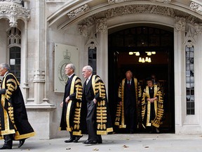 Justices of the Supreme Court leave the Supreme Court of the United Kingdom in Parliament Square in London, in this file photograph dated Oct. 1, 2009. REUTERS/Luke MacGregor/files
