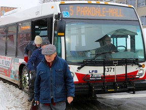 Tim Miller/The Intelligencer
A group of transit riders exit a city bus at a Pinnacle Street stop on Wednesday.