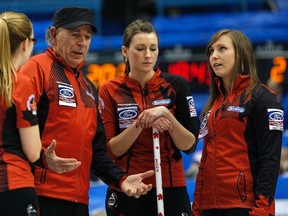 Coach Earle Morris talks with members of Rachel Homan's team at the 2014 world women's championship. (Reuters)
