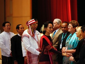 Aung Shine Oo/The Associated Press
Myanmarís pro-democracy leader Aung San Suu Kyi, centre, shakes hands with foreign parliamentary representatives during a workshop to train newly elected Myanmar lawmakers on Monday in Naypyitaw, Myanmar.