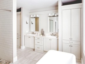 This bathroom features neutral custom cabinetry and maintenance-free quartz countertop. The porcelain tile flooring blends in to create a calming, spa-like feel. (Designer: Cassandra Nordell-MacLean/Copyright William Standen Co. 2015)