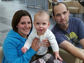 Morgan Latta, right, his 10-month-old son Theo, and his fiancee Stacy Babcock. (Supplied photo)