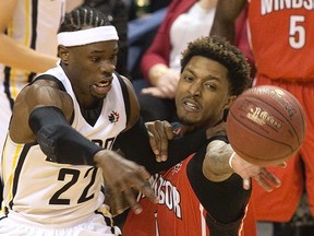 London Lightning guard Tyshawn Patterson and the Windsor Express' Maurice Bolden fight for possession in the first half of their NBL basketball game in London, Ont. on Thursday, Feb. 18, 2016. (DEREK RUTTAN, The London Free Press)