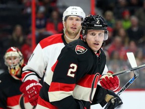 Dion Phaneuf (2) of the Ottawa Senators battles against Jordan Staal of the Carolina Hurricanes on Feb. 18. (Jean Levac, Postmedia Network)