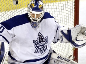 Toronto Maple Leafs goaltender Ed Belfour makes a save against the Bruins in Boston March 25, 2004.(Postmedia Network file photo)