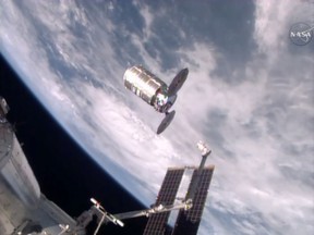 This photo taken from NASA TV shows a capsule loaded with 1.5 tons of trash, released from the International Space Station on Feb. 19, 2016. NASA supplier Orbital ATK launched the capsule, named Cygnus, to the space station in December, full of food, clothes and other goods. Astronauts removed the precious contents, then filled it with garbage for incineration. The spacecraft should re-enter the atmosphere and burn up harmlessly over the Pacific on Saturday.  (NASA via AP)