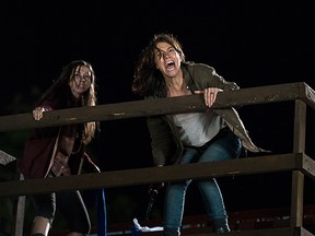 Katelyn Nacon as Enid (left) and Lauren Cohan as Maggie in a scene from The Walking Dead. (Handout)
