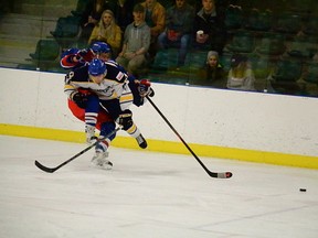 Flyers captain Markus Lovsin was denied entry to his desired path to the puck during the Flyers’ 6-1 victory over St. Albert in Capital Junior Hockey League playoff action. - Photo by Mitch Goldenberg