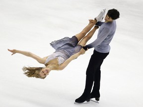 Kaitlyn Weaver and Andrew Poje from Canada perform in the ice dance free dance program at the Four Continents figure skating championships in Taipei, Taiwan, Friday, Feb. 19, 2016. (AP Photo/Wally Santana)
