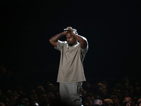 Kanye West pauses as he speaks at the Video Vanguard Award at the 2015 MTV Video Music Awards in Los Angeles, California, in this August 30, 2015 file photo. West, who says he is $53 million in debt, has asked Facebook Inc's Chief Executive Officer Mark Zuckerberg to invest $1 billion into his "ideas".  REUTERS/Mario Anzuoni