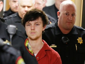 Ethan Couch is led by sheriff deputies after a juvenile court for a hearing in Fort Worth, Texas, on Feb. 19, 2016. A Texas judge ruled Couch, who used an "affluenza" defence in a fatal drunken-driving wreck will be moved to adult court, meaning the teen could face jail time for the 2013 wreck that killed four people. (AP Photo/LM Otero)