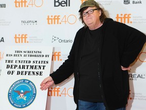 Michael Moore walks the red carpet at the Princess of Wales Theatre for his premiere of "Where To Invade" ,  during the Toronto International Film Festival in Toronto on Thursday September 10, 2015. Stan Behal/Toronto Sun/Postmedia Network