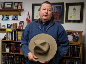 Retired RCMP officer Paul Christoffersen poses for a photo, in Fort Saskatchewan Alta. on Thursday Feb. 18, 2016. Christoffersen says RCMP Auxiliary Officers have had their role and responsibilities reduced by RCMP brass. Photo by David Bloom