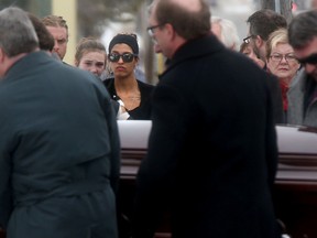 Family and friends gathered to attend the funeral of Bernard Cameron at the Holy Name of Mary Parish Church in Almonte Ontario Friday Feb 19, 2016. Bernard's daughter Sarah (sun glasses) attended the funeral. Tony Caldwell.