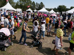 Tens of thousands of people showed up at Hawerlak Park in Edmonton on Sunday Aug. 3, 2015 to take in the final day of the 40th annual Servus Heritage Festival. Tom Braid/Postmedia Network.
