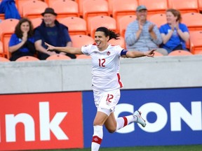 Canada's Christine Sinclair celebrates after scoring a goal against Costa Rica during the first half of their CONCACAF Olympic women's soccer qualifying championship semifinal on Friday in Houston. (AP/PHOTO)