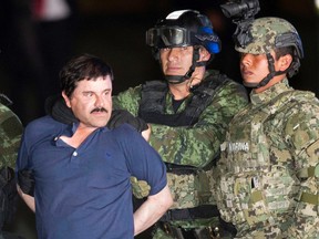 In this Jan. 8, 2016 file photo, Joaquin "El Chapo" Guzman is made to face the press as he is escorted to a helicopter in handcuffs by Mexican soldiers and marines at a federal hangar in Mexico City, Mexico, following his recapture six months after escaping from a maximum security prison. Guzman's lawyers said Friday, Feb. 19, 2016 he told them that guards at Mexico’s Altiplano prison won’t let him sleep, and that plans to make a movie about his life with Mexican actress Kate del Castillo are still on. (AP Photo/Eduardo Verdugo, File)