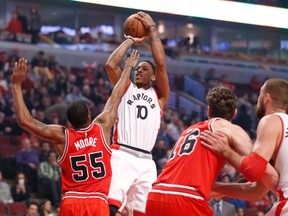 Toronto Raptors guard DeMar DeRozan shoots over Chicago Bulls guard E'Twaun Moore during the first half of a game in Chicago on Feb. 19, 2016. (AP Photo/Charles Rex Arbogast)