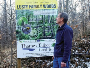 Stan Caveney, a member of the Talbot Land Trust, strolls the Lusty Family Woods property in West Elgin, a nature preserve owned and managed by it.
