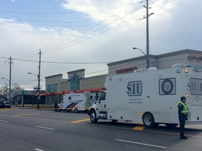An SIU vehicle outside a TD Bank branch on The Queensway at Kipling Ave. where a man was shot (Chris Doucette/Toronto Sun)