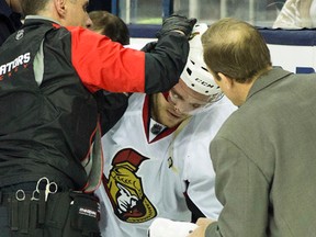 Ottawa Senators head trainer Gerry Townend tends to injured defenseman Mark Borowiecki during the game against the Columbus Blue Jackets at Nationwide Arena. (Greg Bartram-USA TODAY Sports)