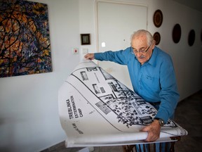 Holocaust survivor Samuel Willenberg displays a map of Treblinka extermination camp during an interview with the Associated Press at his house in Tel Aviv, Israel, in this Oct. 31, 2010 file photo. Willenberg, the last survivor of Treblinka, the Nazi death camp where 875,000 people were killed, has died at 93. (AP Photo/Oded Balilty, File)
