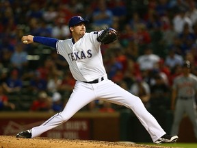 Tanner Scheppers of the Texas Rangers pitches in the seventh inning during a game against the Detroit Tigers at Globe Life Park in Arlington on September 28, 2015 in Arlington, Texas.  (Sarah Crabill/Getty Images/AFP)