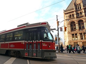 Old TTC streetcar runs along Queen St. in Toronto. (Dave Abel/Toronto Sun)