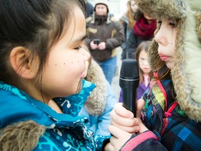 Samantha Kigutaq-Metcalfe, 12 and Cailyn Degrandpre, 11 were throat singing at the Inuit Day celebrations Saturday February 20, 2016 at the Ottawa Inuit Children Centre.