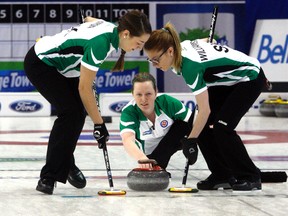 Ashley Howard, third for Team Saskatchewan, delivers a rock during the first draw of the Scotties Tournament of Hearts Saturday at Revolution Place in Grande Prairie, Alta. Saskatchewan defeated Nova Scotia 11-7.