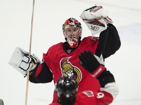 Ottawa Senators' goalie Craig Anderson celebrates with teammate Bobby Ryan after winning a shootout against the Detroit Red Wings on Feb. 20. (The Canadian Press)