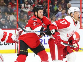 Senators winger Chris Neil checks Brad Richards of the Detroit Red Wings during the first period on Feb. 20 at the CTC. (Jean Levac, Postmedia Network)