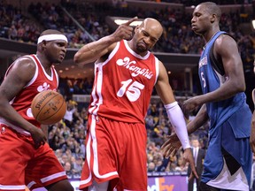 Memphis Grizzlies guard Vince Carter reacts between Grizzlies forward Zach Randolph, left, and Minnesota Timberwolves centre Gorgui Dieng after scoring in a game in Memphis on Feb. 19, 2016. (AP Photo/Brandon Dill)